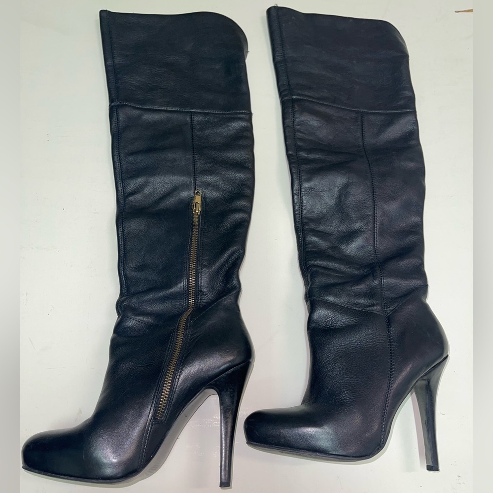 Over the knee Steve Madden black leather high heel boots.